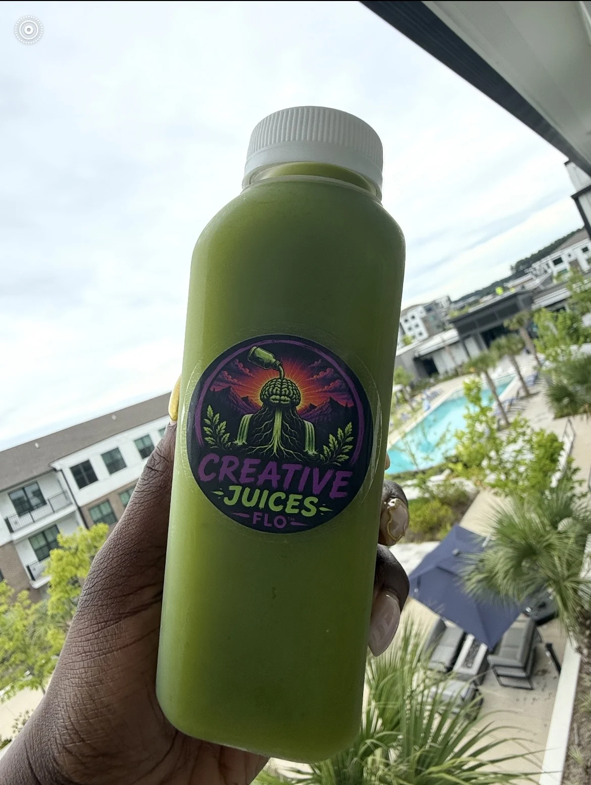 Live green juice photo with balcony view